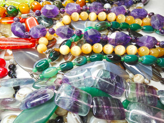 jewelry fashion beads necklace background with colorful crystals