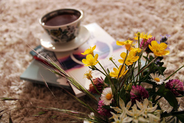Morning begins with coffee and a good book