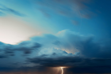 Fototapeta na wymiar Lightning in the evening sky