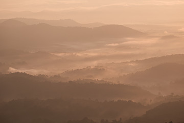 Twilight, sunrise and sea of fog in the morning on the mountains of northern Thailand, during the rainy season.