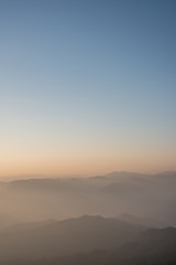 Twilight, sunrise and sea of fog in the morning on the mountains of northern Thailand, during the rainy season.