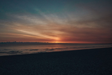 Stunning colorful sunset on a sandy beach.
