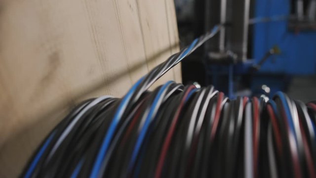 Industrial cable production. Winding the cable onto the reel.