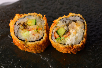 fried sushi on a natural stone