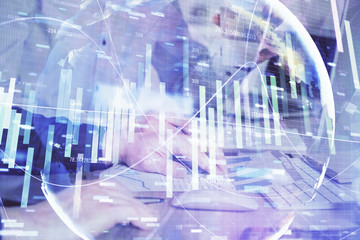 Double exposure of businessman working on laptop on background. International business hologram in front. Concept of success.