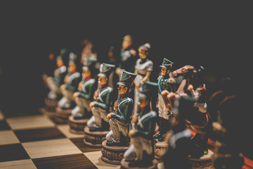 old chess game with military soldiers