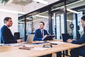 Group of adult successful multiethnic people in meeting
