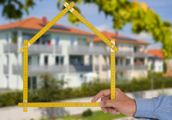 newly built house with a yardstick