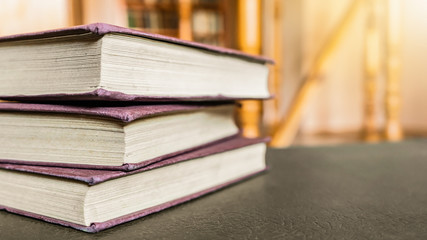 Pile of red books in the library. Selective focus.