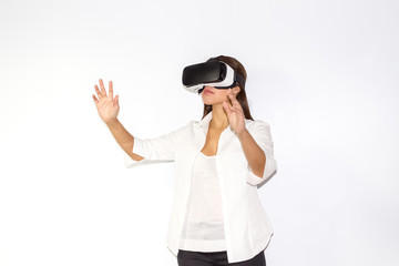 Beautiful Girl tries VR headset on white background