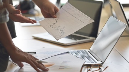 close up of business people working with document in office