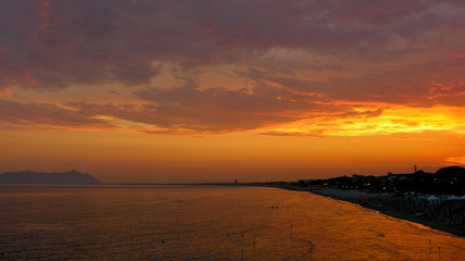 Fiery sunset over the beach of Terracina in Italy.