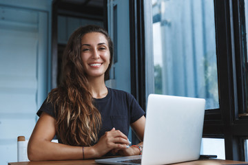 Happy smart woman working from home, freelancer using computer, work with laptop remote during...