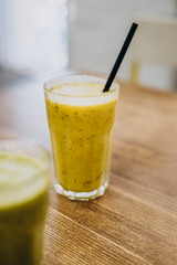 Glass of tasty healthy smoothie on the table.