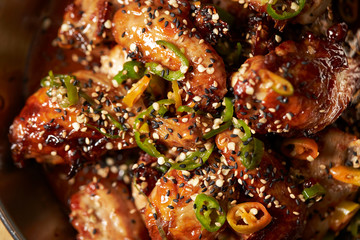 Sauce marinated chicken with sesame and chili pepper 