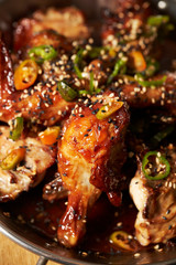 Sauce marinated chicken with sesame and chili pepper 