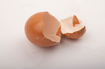 The shell of a broken chicken egg on a white background. Close up.