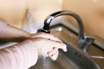 Corona virus travel prevention wash hands with soap and hot water. Hand hygiene for coronavirus outbreak. Protection by washing hands frequently.