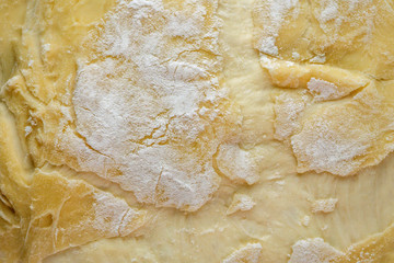 raw dough close-up macro texture. yellow butter yeast dough, macro shot, concept