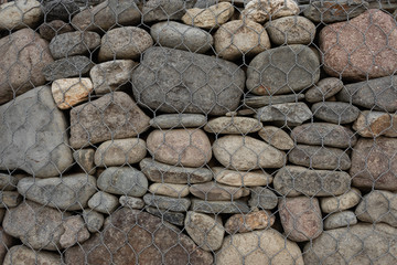 reinforcement of stones that are fixed in the net of rowan.