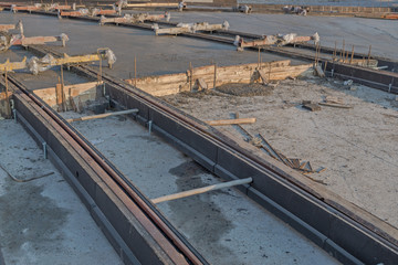 City road intersection. Reconstruction and replacement of railway tramways. New lines of rails with supporting fittings, struts, communications and formwork, filled with cement and concrete screed.