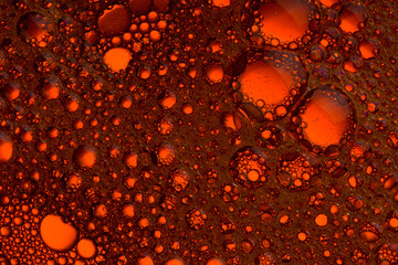red orange water bubbles abstract background close up