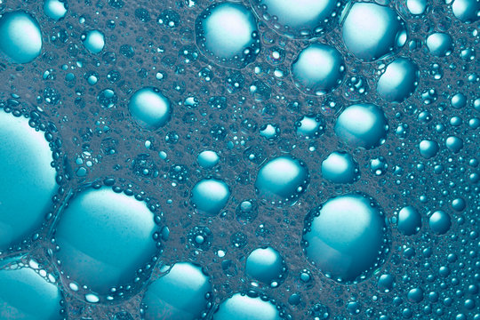Soap foam bubbles macro. Abstract Background Blue © alan