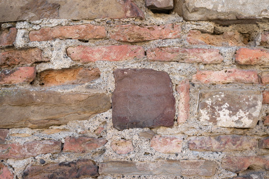 several old stones lie on top of each other. T