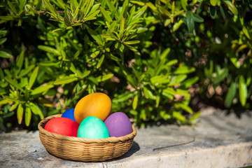colorful easter eggs in a basket