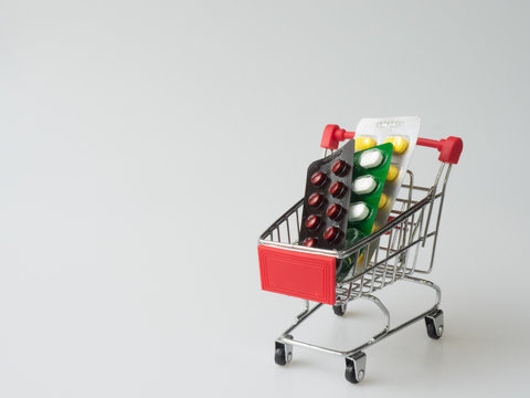 The medicine panels are in the basket of shopping cart. The concept is for treatment and medication by using allopathic medicine.