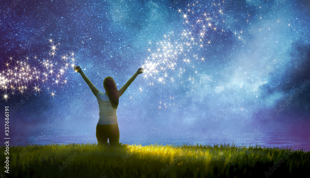 Wall mural girl watching the stars in night sky fantasy landscape