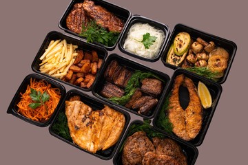 Fried meat and fish steak with vegetables view