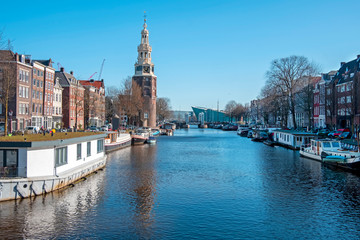 Fototapeta premium City scenic from Amsterdam in the Netherlands with the Montelbaan tower