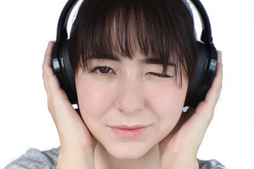 Fototapeta premium young woman listening to music