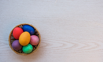 colorful easter eggs in a basket