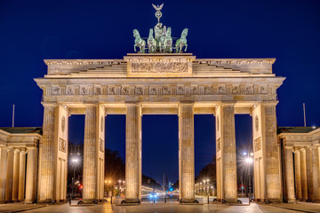 Fototapeta na wymiar The illuminated Brandenburg Gate in Berlin at night with no people