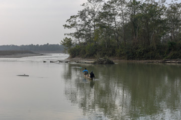 Fototapeta na wymiar Fisherman at Rapti river of Chitwan national park in Nepal