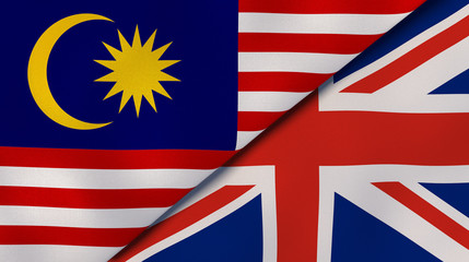 The flags of Malaysia and United Kingdom. News, reportage, business background. 3d illustration