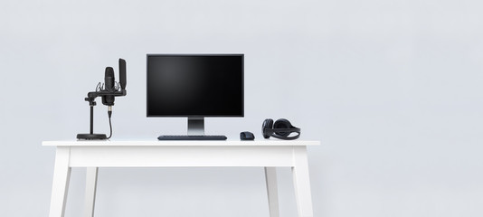 Home podcast recording studio on white table.