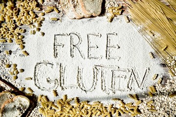 Naklejka premium Gluten-free. Assortment of pasta on a wooden table. The concept of healthy eating.