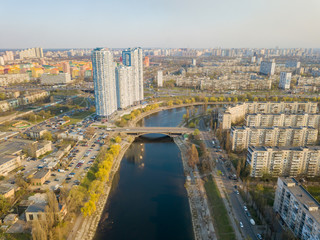 Fototapeta na wymiar Residential area Rusanovka in Kiev in the evening sunshine. Aerial drone view.