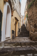 Fototapeta na wymiar Narrow stairs and streets in the tourist village of Positano, Amalfi coast