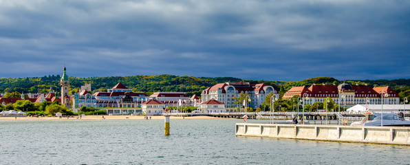 Panoramic view of Sopot with a view of the pier, old lighthouse and characteristic architecture during the autumn walk on the pier. - obrazy, fototapety, plakaty