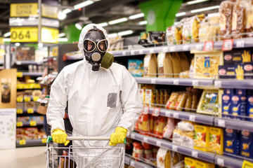Coronavirus in Russia. People in biological suits and masks in a supermarket