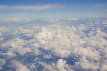 Naklejka na ściany i meble Beautiful Clouds of Vertical Development, Stratocumulus, Cumulus sky on the top view, airplane flying view from inside window aircraft of Traveling.