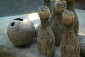 Old wooden skittles and wooden bowling ball