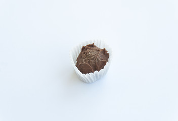 Handmade truffle candy isolated on white background. Close up