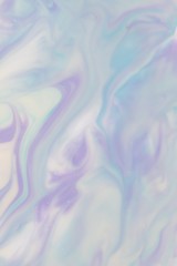 Abstract background of mixed shades of nail polish with a pastel