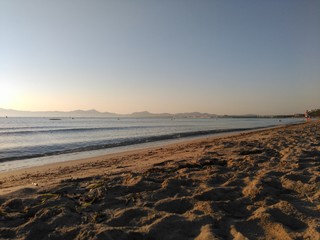 Seaview of the beach of the Mallorca coastline with on the sunset
