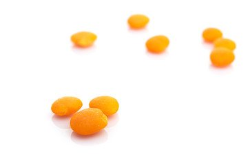 Fototapeta na wymiar Seeds lentils isolated on white. Pile healthy orange pea food on organic background. Superfood high vitamin e, antioxidant, omega-3, protein and dietary fiber for healthy food.